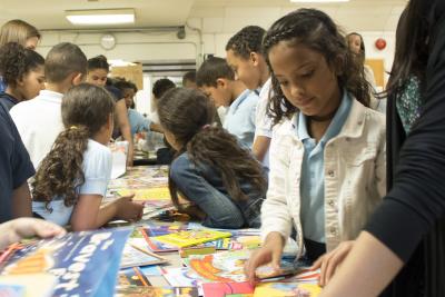 Students at Cleveland Elementary School in Allentown, Pa., select their summer reading books from PPL.