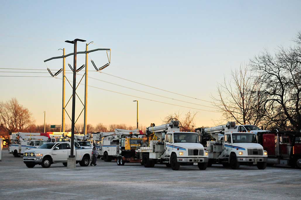 PPL Electric Utilities bucket trucks lined up in staging area