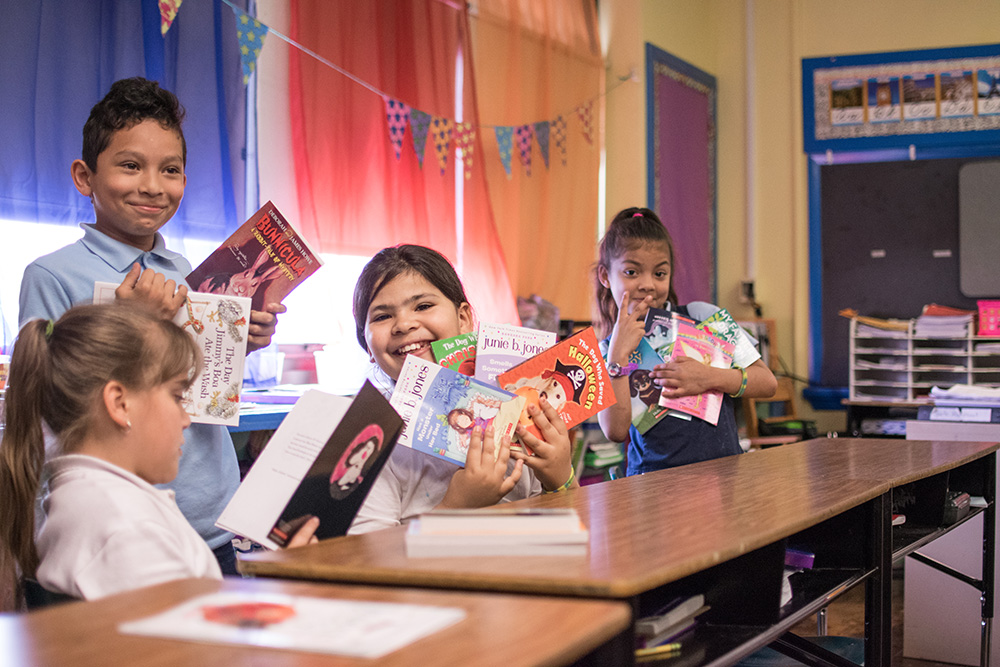 Students at Cleveland Elementary School in Allentown, Pa., show their enthusiasm for the books they selected through the PPL Cover to Cover program.