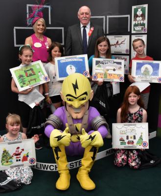 Brecon Pupils from Mount Street Junior School, Llanwrtyd Wells are pictured receiving their prizes from Royal Welsh Lady Ambassador Georgina Cornock-Evans and WPD’s Phil Davies and Superhero Pylonman.