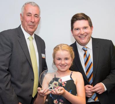 Megan Crombie-Davies, winner of the Tenovus Young Volunteer Award, is pictured with WPD’s Distribution Manager Ian Lawrence (left) and ITV presenter and Patron of the charity, Carl Edwards.